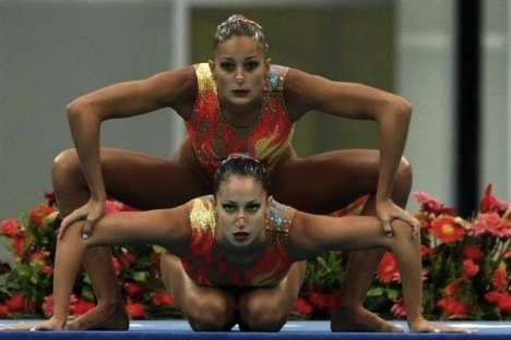 Evanthia Makrygianni and Despoina Solomou of Greece perform at the start of their duet synchronised swimming technical routine at the Beijing 2008 Olympic Games